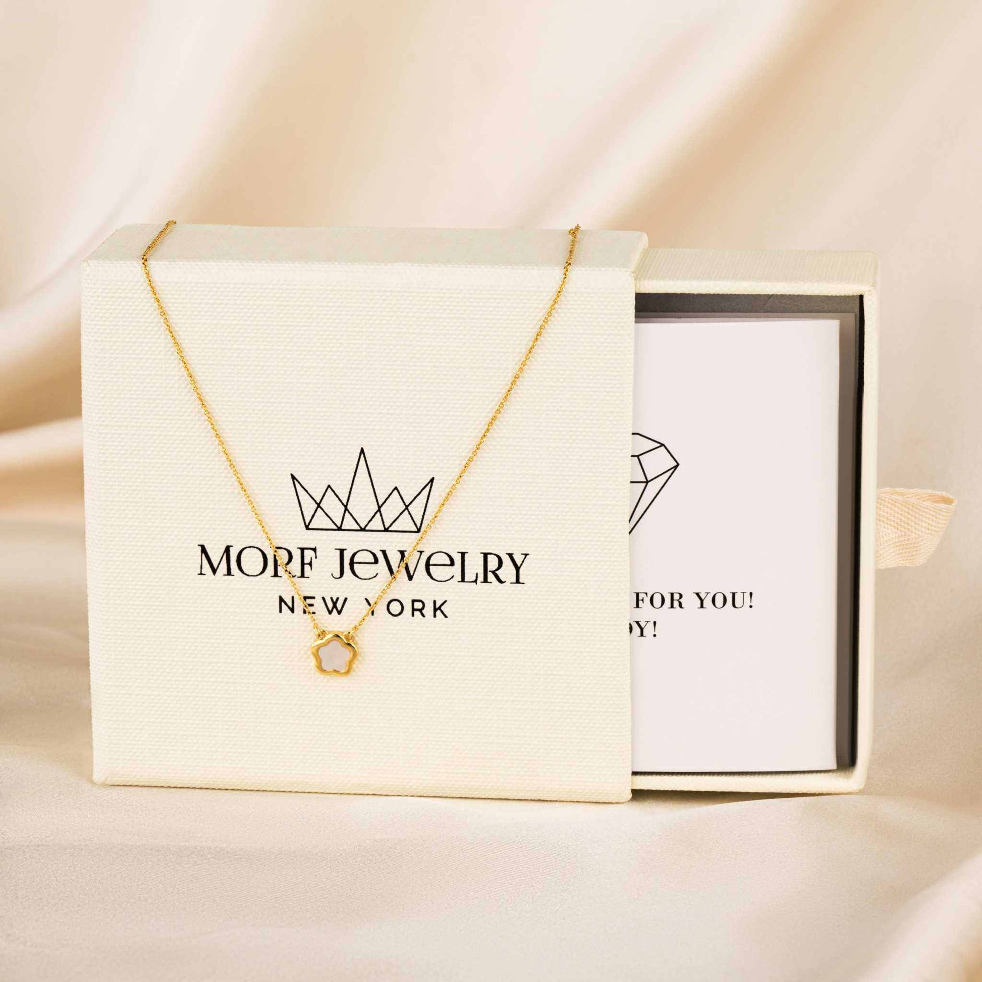 Nacre Flower Necklace with five-petal Mother-of-Pearl pendant on 14K gold chain.