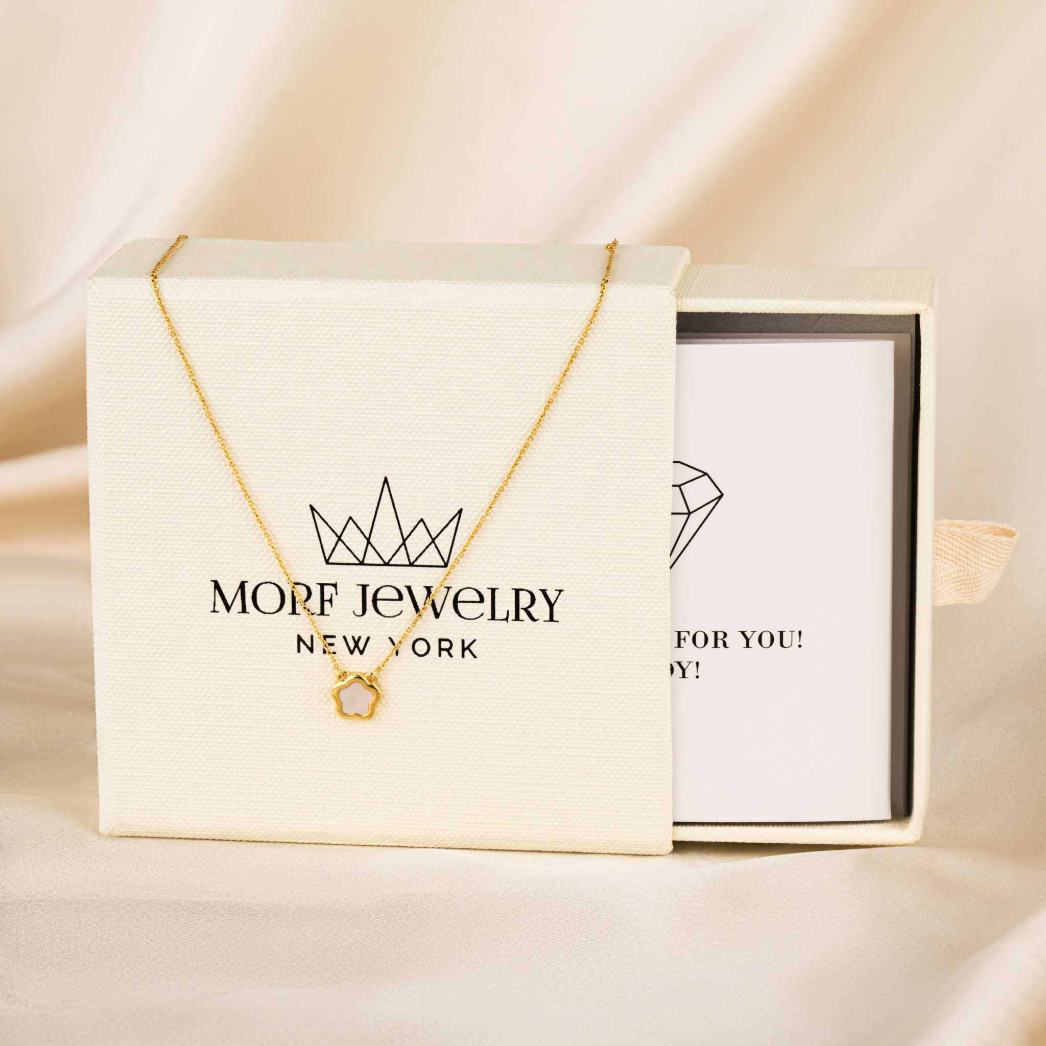 Nacre Flower Necklace with five-petal Mother-of-Pearl pendant on 14K gold chain.