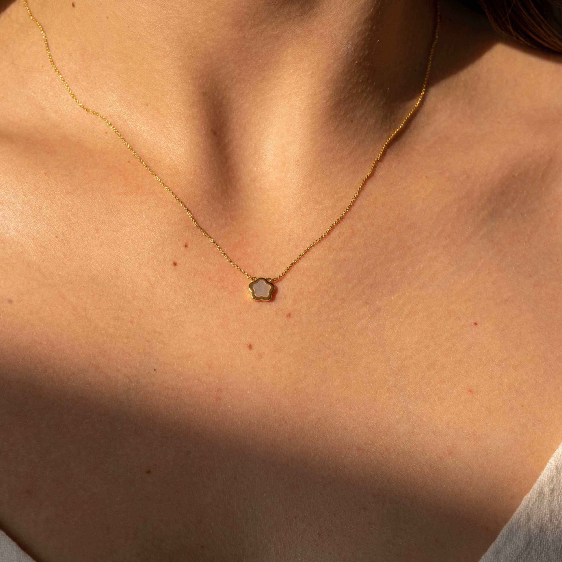 Nacre Flower Necklace with Mother-of-Pearl pendant on gold-dipped chain.