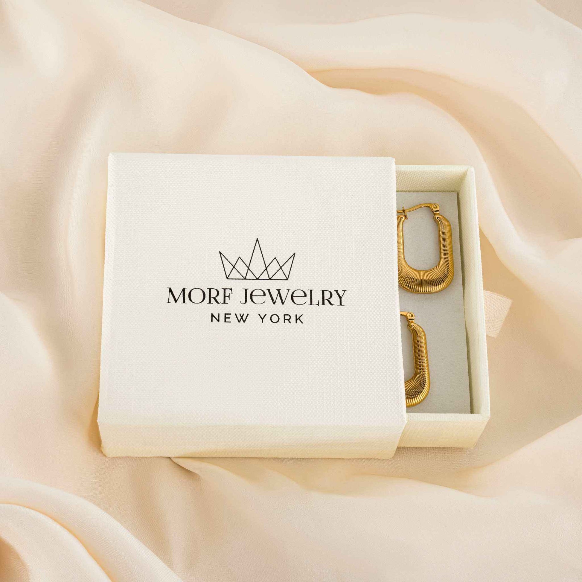 Solstice Earrings with 18k PVD gold plating in brand box.