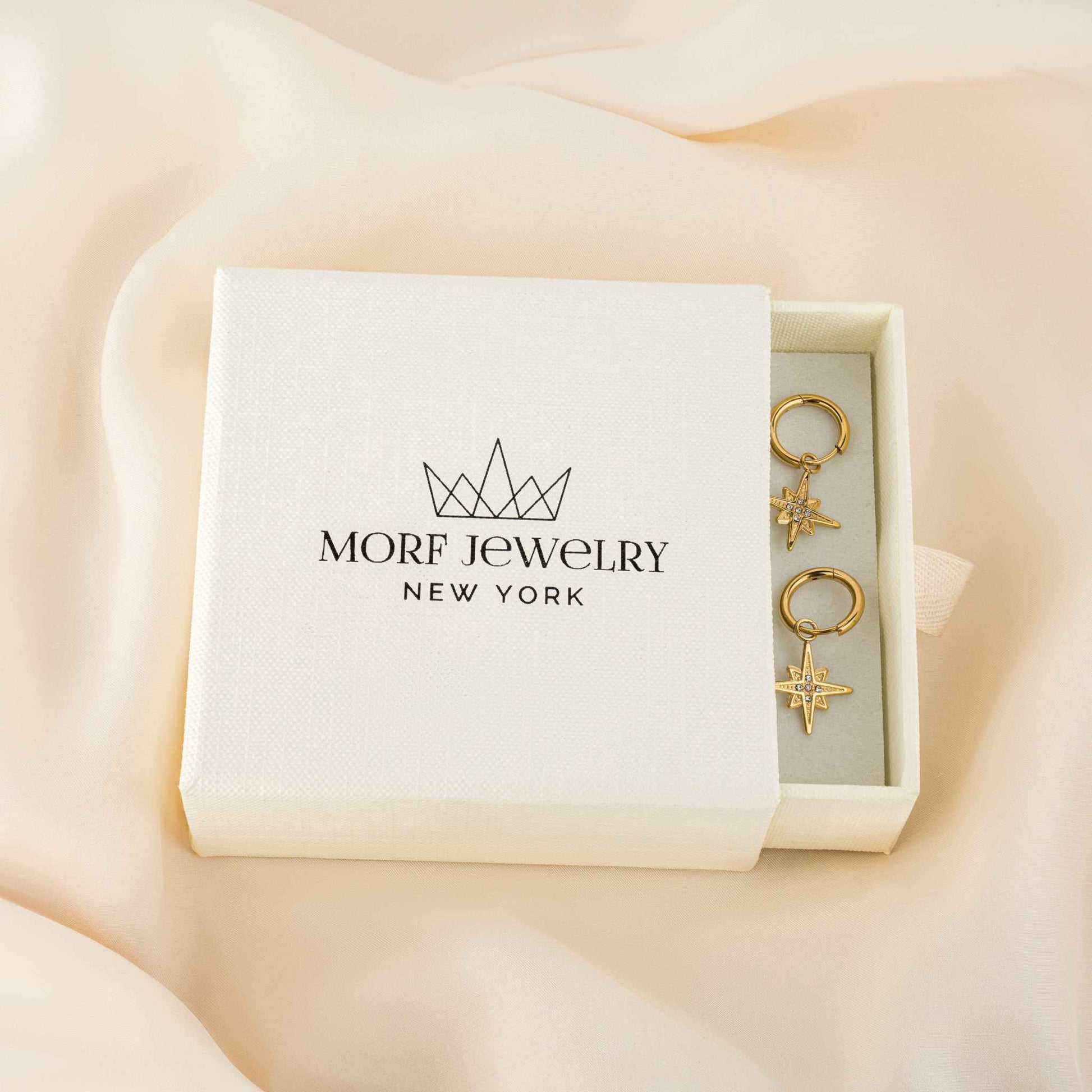 Starburst Huggie Earrings in brand box, 18k PVD gold plated, hypoallergenic, tarnish-free, waterproof.