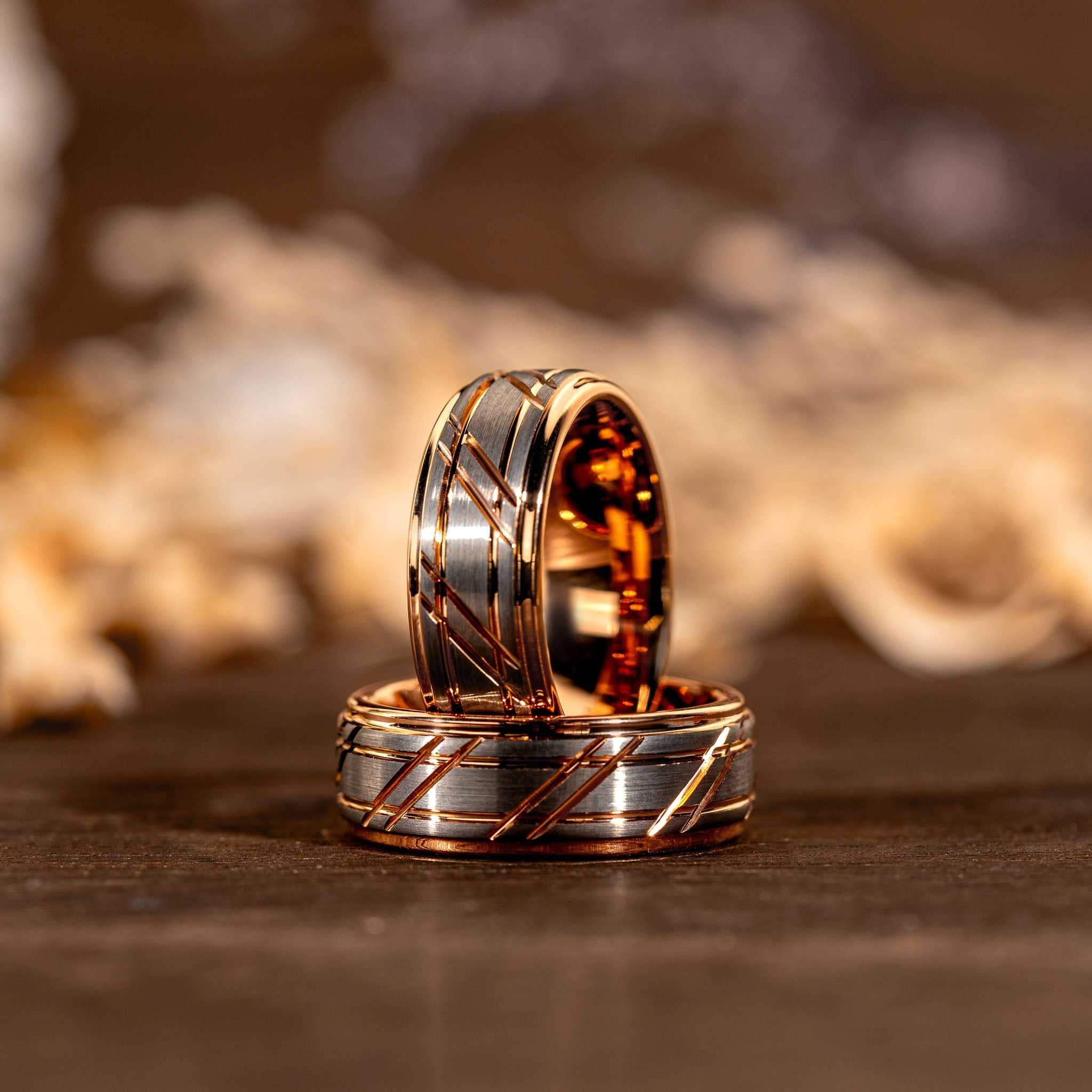 Rose gold tungsten carbide wedding rings with hammered texture and gold-plated finish